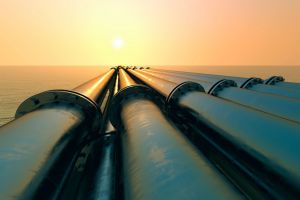 Sunset view of oil pipelines extending into the horizon in Venezuela, symbolizing energy sector opportunities